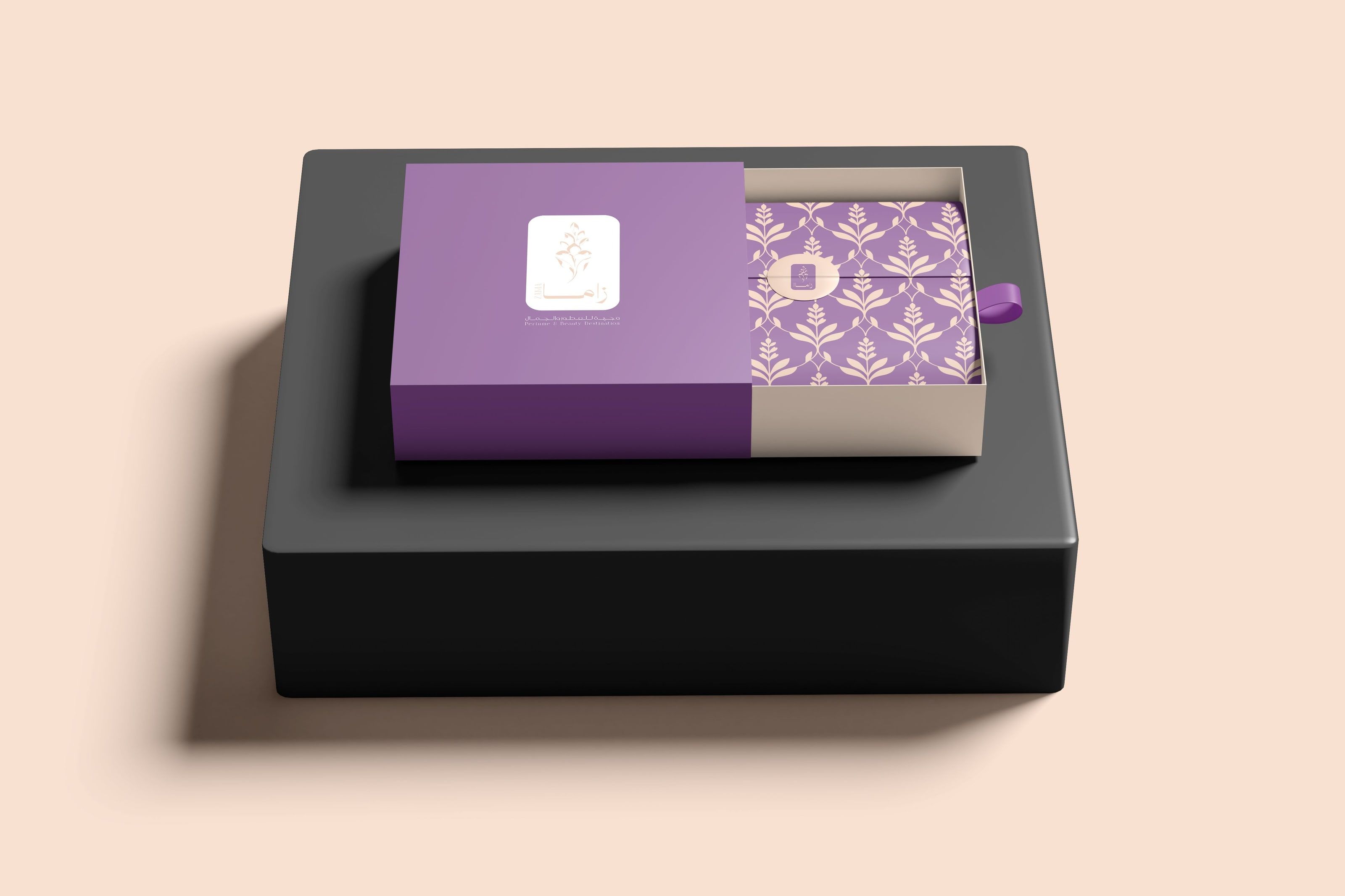 The Zama gift box: a purple sleeve with the Zama badge, its lavender-patterned drawer sliding out, closed with the round Zama seal